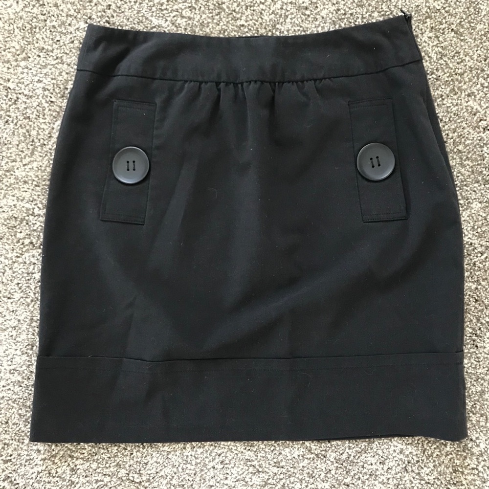 Black thigh length skirt chunky buttons pockets